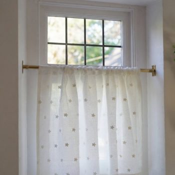 Gold cafe rod on a window from Net Curtains Direct