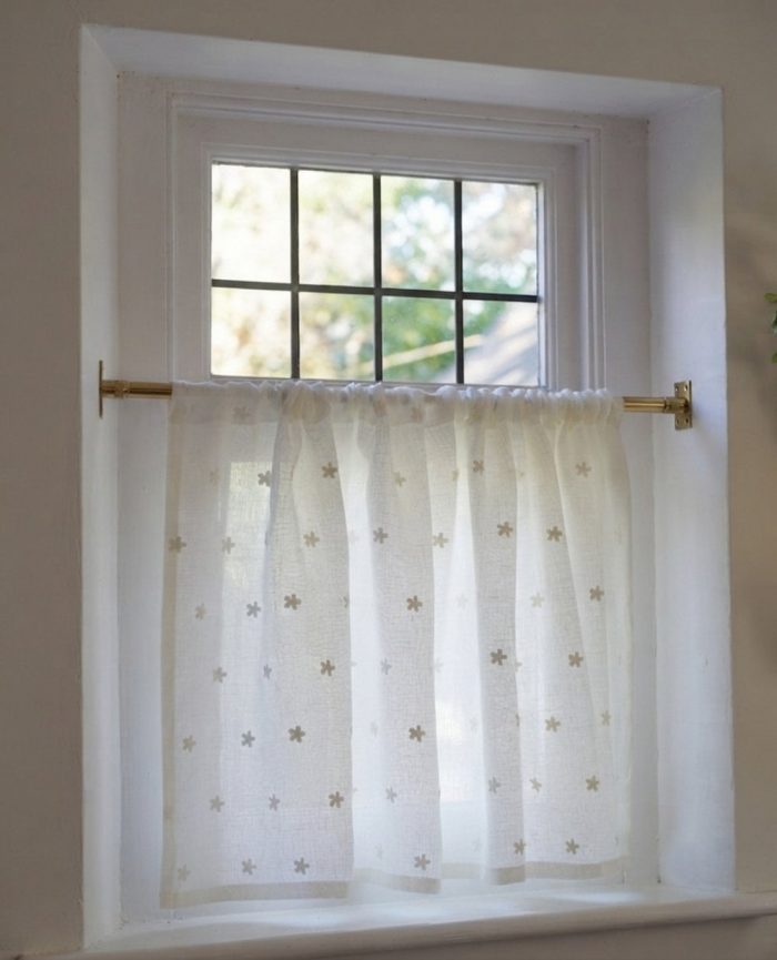Gold cafe rod on a window from Net Curtains Direct