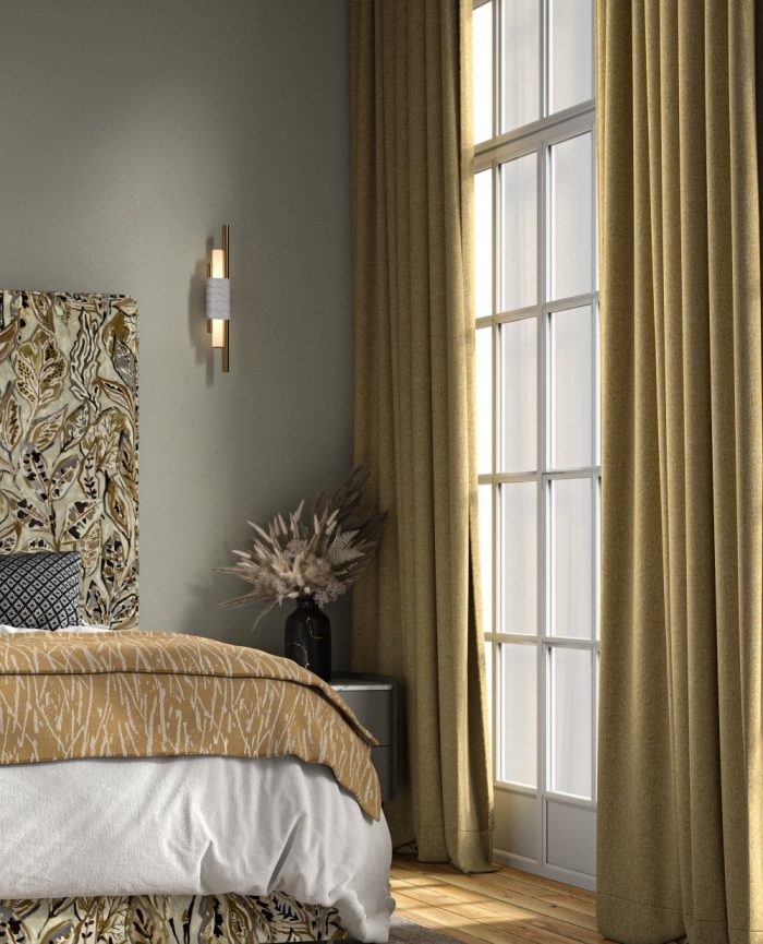 Mustard coloured heavyweight curtains hanging in a bedroom with a matching bed cover.