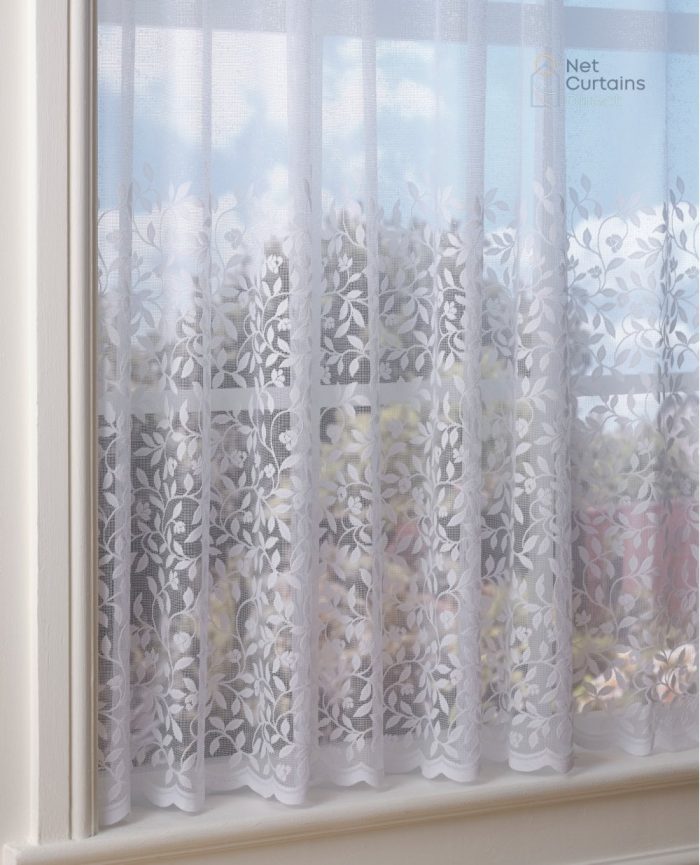 White net curtain with embroidered vertical leaf prints