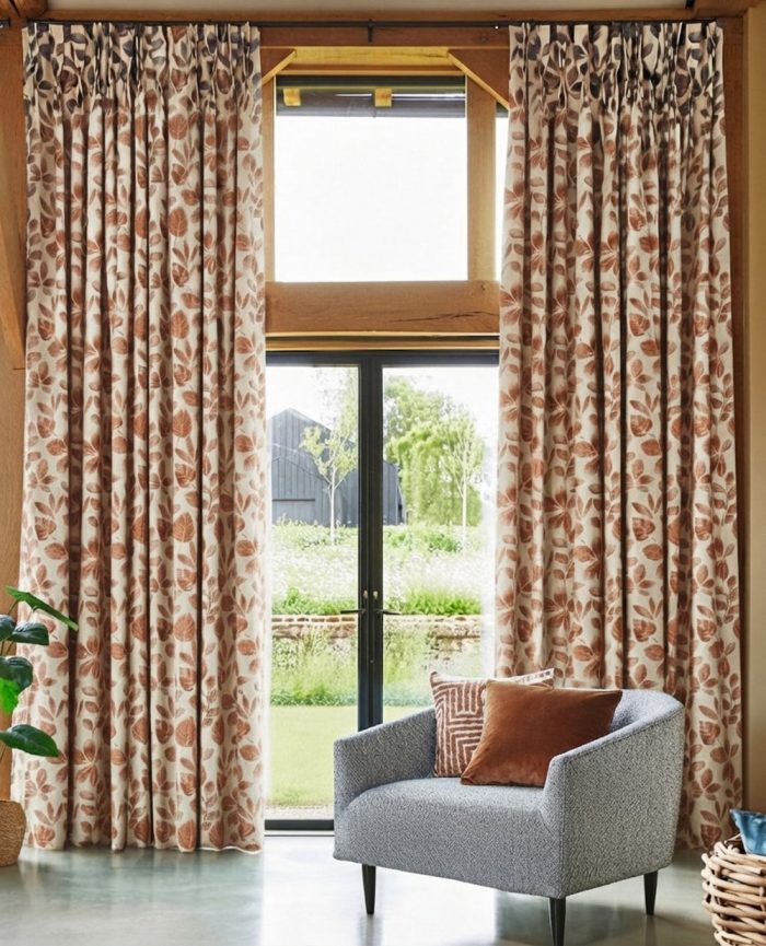 Natural and copper coloured heavyweight curtain with a vertical leaf print